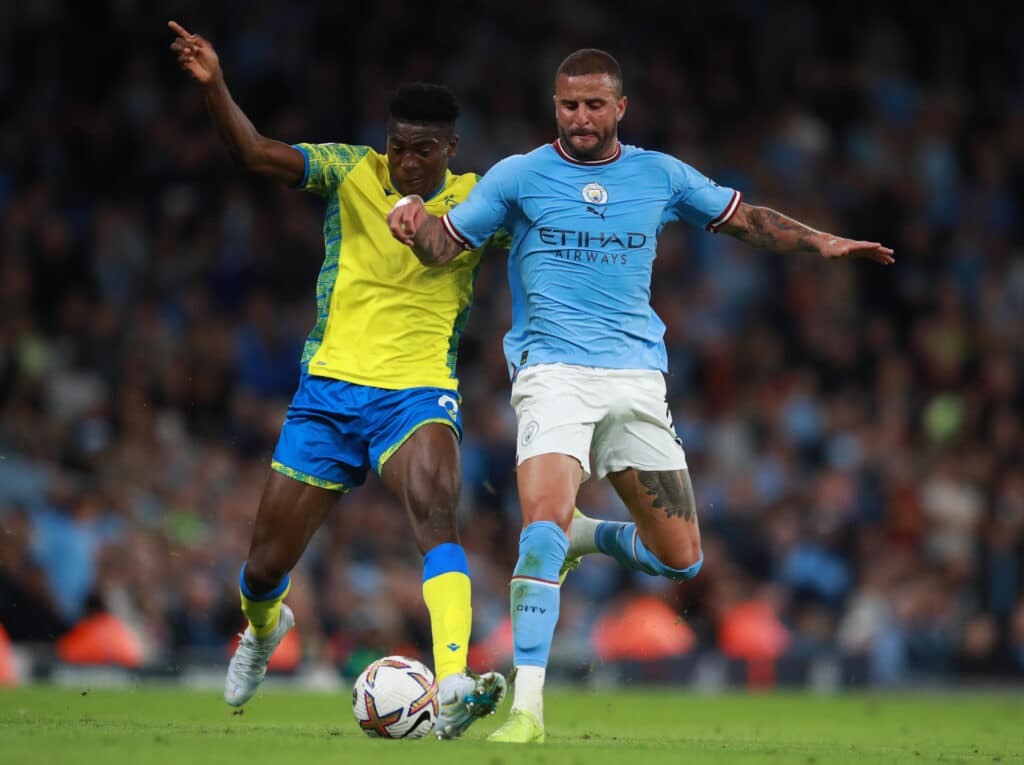 Man City vs Nottingham Forest lineups - Can Awoniyi outshine Haaland? 2 Kyle Walker of Manchester City tackles Taiwo Awoniyi of Nottingham Forest